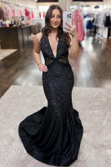 Long Beaded Black Prom Dress with Sparkly Halter and Backless Design Featuring Appliques