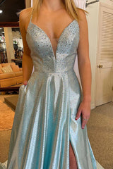 Long V-Neck Prom Dress in Light Blue Featuring a Criss Cross Back