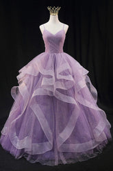 Light purple long prom dress with spaghetti straps and ruffles in an A-line cut