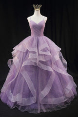 Light purple long prom dress with spaghetti straps and ruffles in an A-line cut