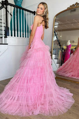 Pink long prom dress with spaghetti straps and ruffles in an A-line silhouette