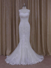 Look Radiant in this Trumpet/Mermaid V-neck Tulle Court Train Wedding Dress with Appliques Lace