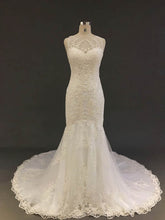 Luxurious Trumpet/Mermaid Illusion Tulle Court Train Wedding Dress With Appliques Lace