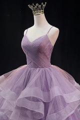 Light purple long prom dress with spaghetti straps and ruffles in an A-line cut