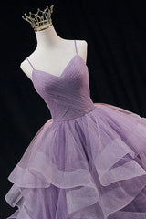 Light purple long prom dress with spaghetti straps and ruffles in an A-line cut