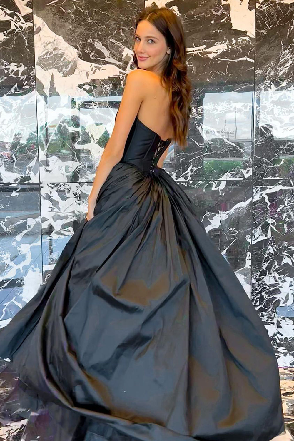 Black Strapless A-Line Prom Dress Featuring a Criss-Cross Back