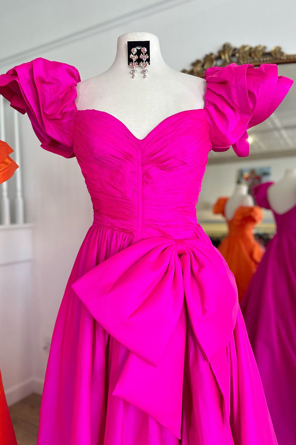 Elegant Fuchsia A-Line Prom Dress with Puff Sleeves Ruched Detail and Bow
