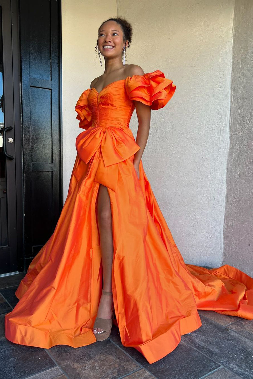 Elegant Orange A-Line Prom Gown with Puff Sleeves Ruched Detail and Bow