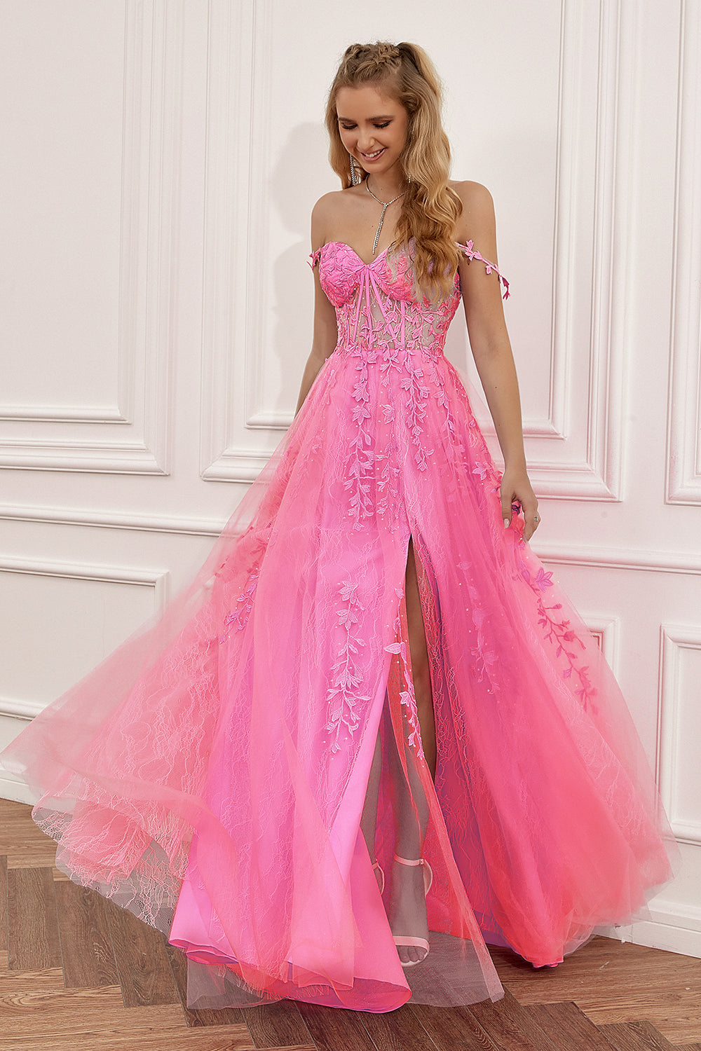 Prom dress in navy featuring off-the-shoulder design and appliques