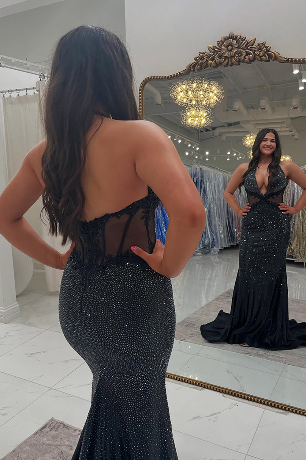 Long Beaded Black Prom Dress with Sparkly Halter and Backless Design Featuring Appliques