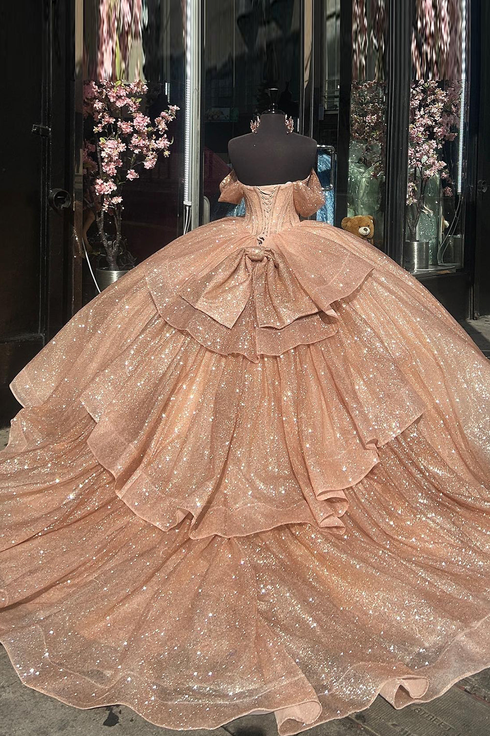 Champagne Sparkle Off-Shoulder Tulle Quinceanera Dress Featuring Ruffles and Bow