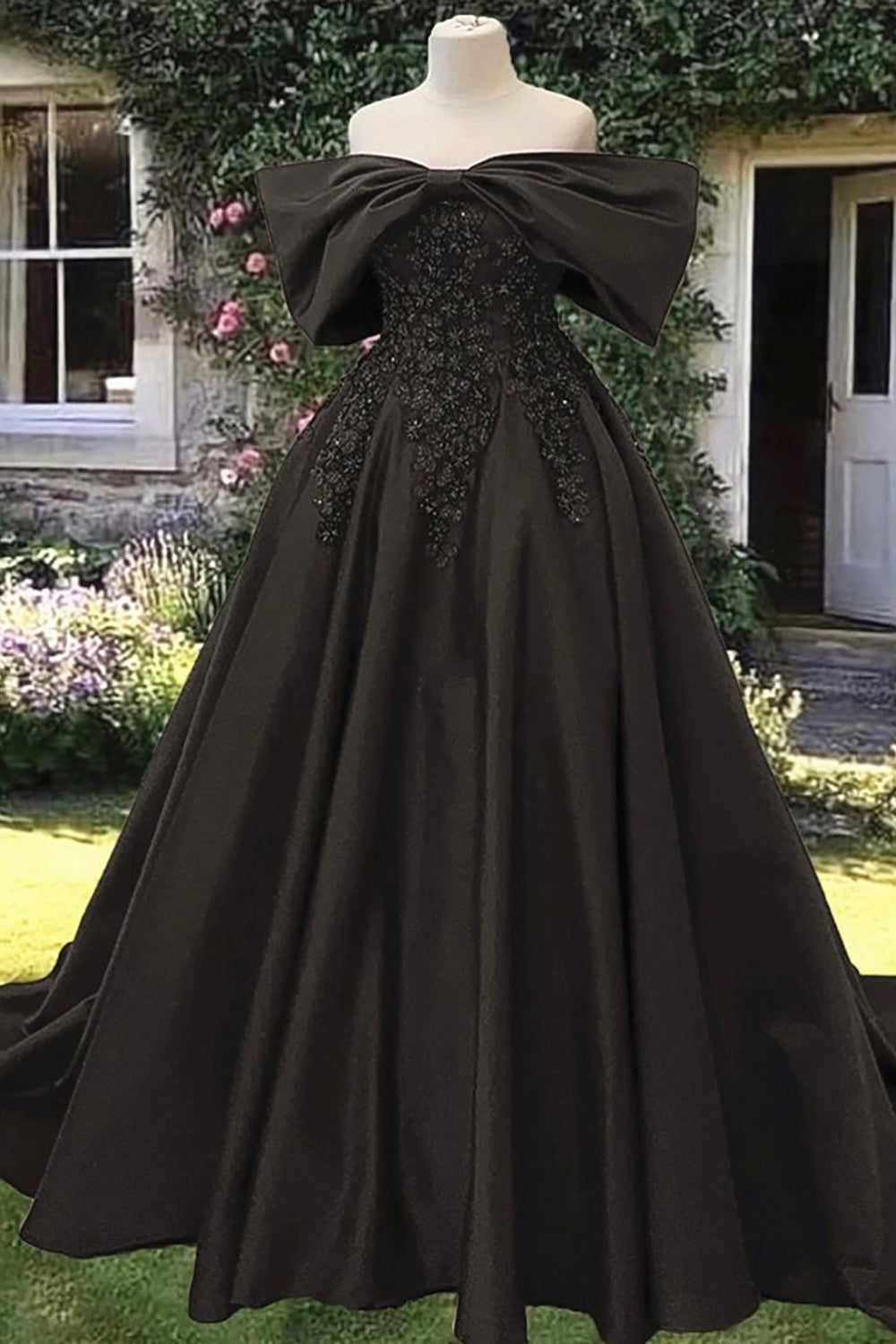 Off-the-shoulder black satin princess ball gown with lace for quinceanera
