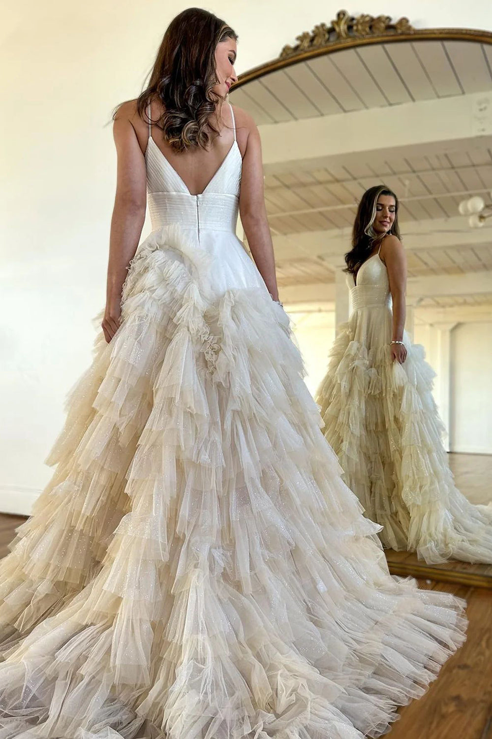 Pink long prom dress with spaghetti straps and ruffles in A-line style