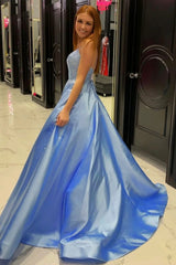 Long Blue Prom Dress with Spaghetti Straps and Criss Cross Back in A-Line Silhouette