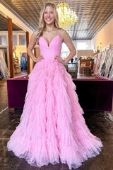 Pink long prom dress with spaghetti straps and ruffles in A-line style