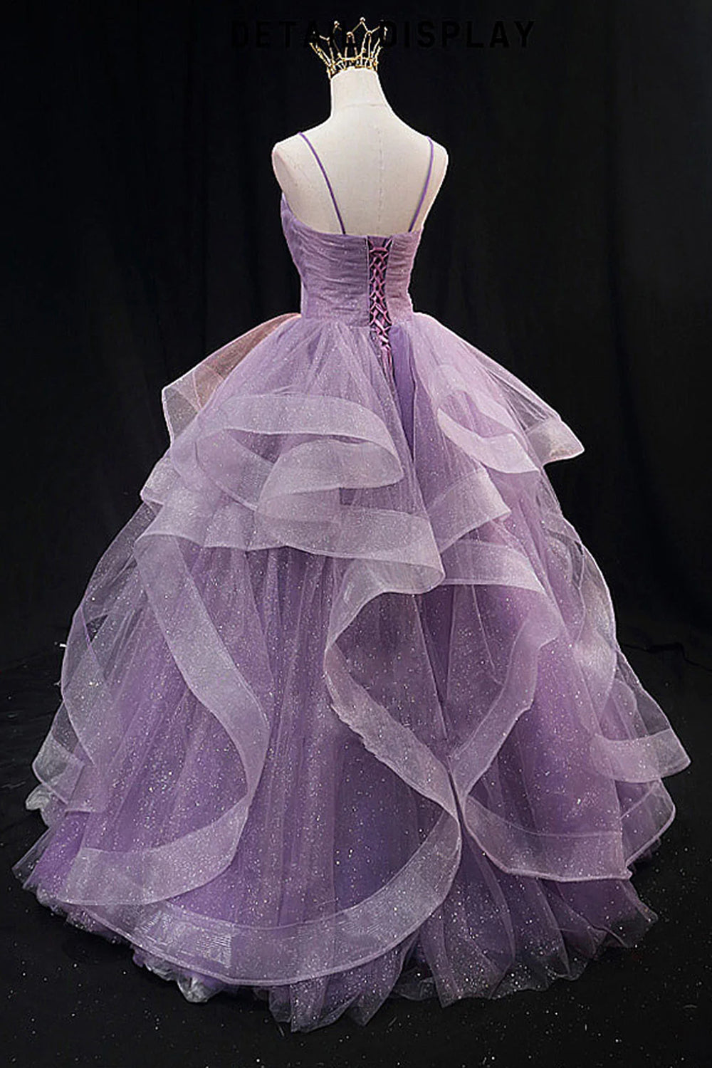 Light purple long prom dress with spaghetti straps and ruffles in an A-line cut