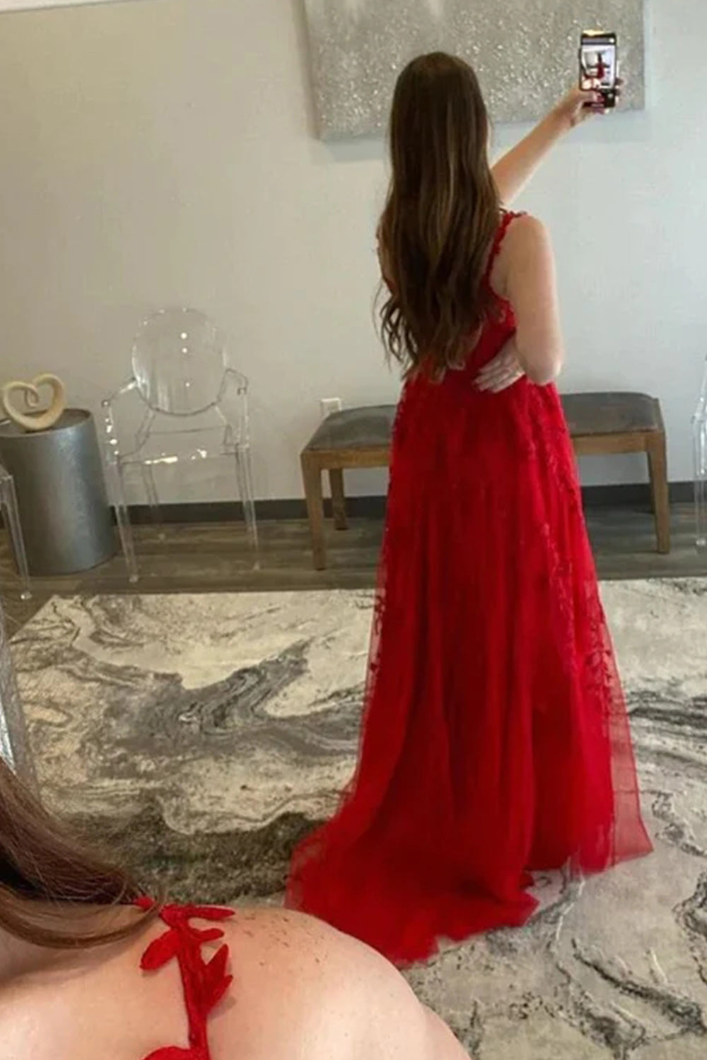 Prom dress in navy featuring off-the-shoulder design and appliques
