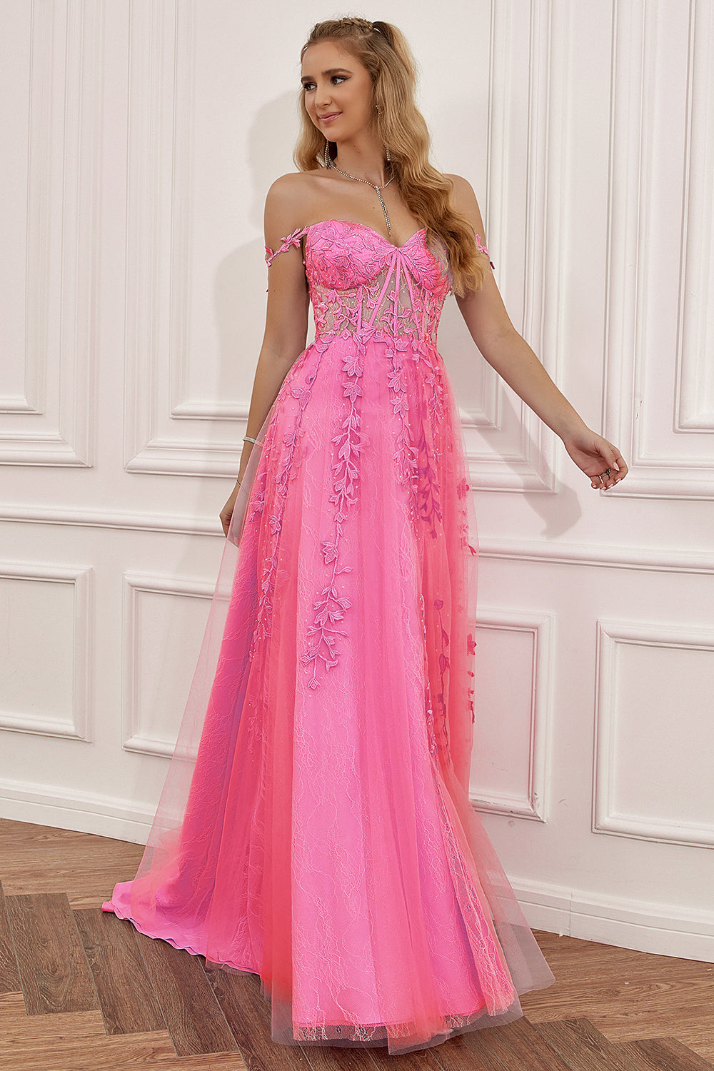 Prom dress in navy featuring off-the-shoulder design and appliques