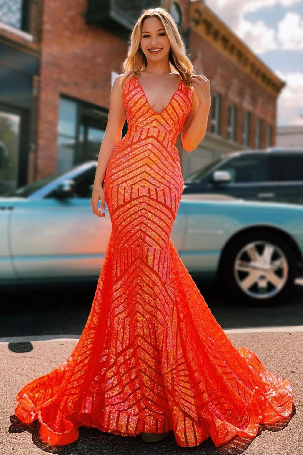 Long Prom Dress with Sparkly Blue Mermaid Cut and Red Sequins in Deep V Neck