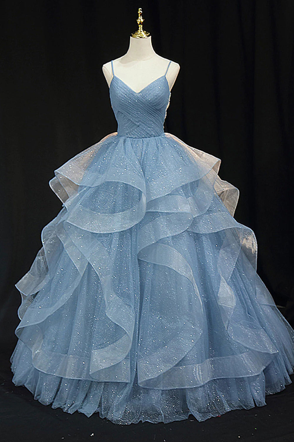 Light purple long prom dress with spaghetti straps and ruffles in an A-line cut